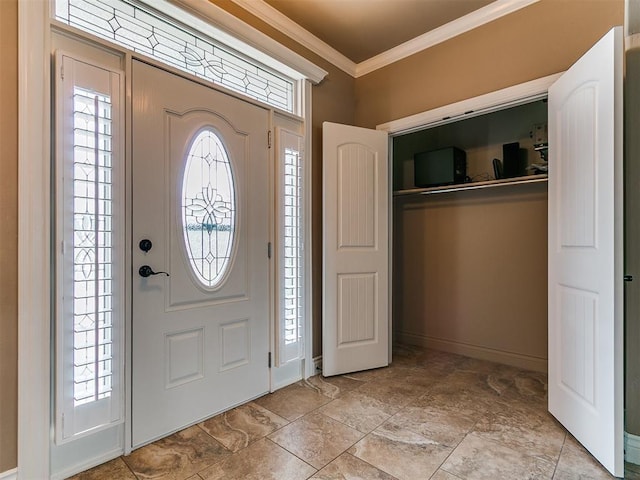 entryway featuring ornamental molding and baseboards