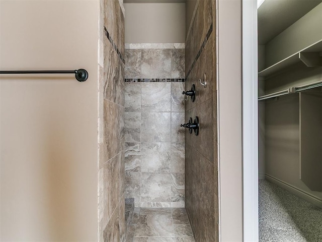 full bath with tiled shower