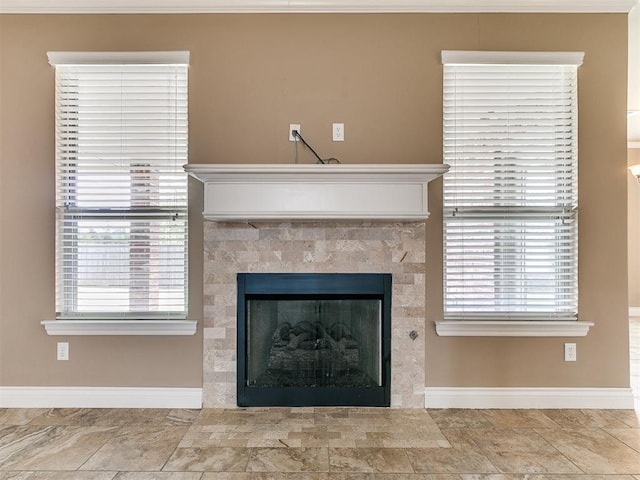 detailed view of baseboards and a fireplace