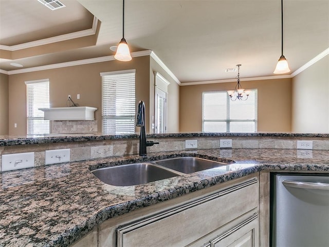 kitchen featuring dishwasher, a sink, decorative light fixtures, a chandelier, and crown molding