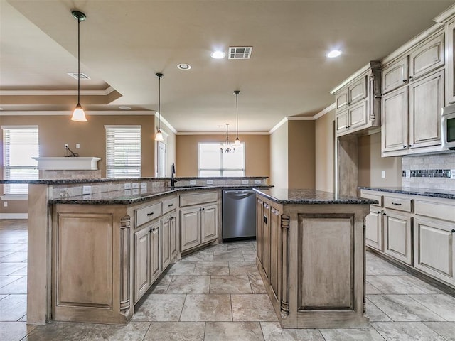kitchen with a center island with sink, appliances with stainless steel finishes, a sink, ornamental molding, and backsplash