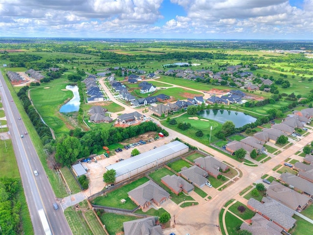 aerial overview of property's location featuring a nearby body of water and nearby suburban area