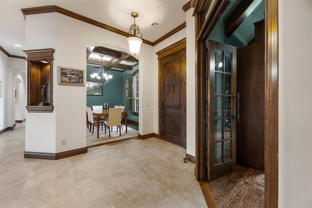 1401 Canyon Bridge Ln, Edmond, OK 73034 - entryway featuring arched walkways, coffered ceiling, crown molding, a chandelier, and baseboards