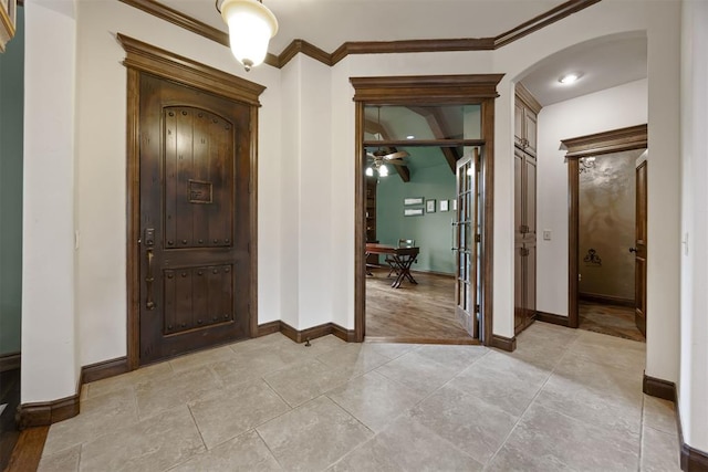 1401 Canyon Bridge Ln, Edmond, OK 73034 - foyer with arched walkways, ornamental molding, baseboards, and a ceiling fan
