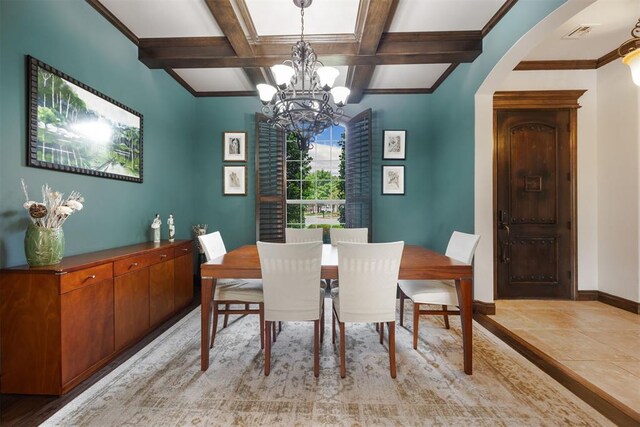 1401 Canyon Bridge Ln, Edmond, OK 73034 - dining area with a chandelier, arched walkways, beamed ceiling, baseboards, and crown molding