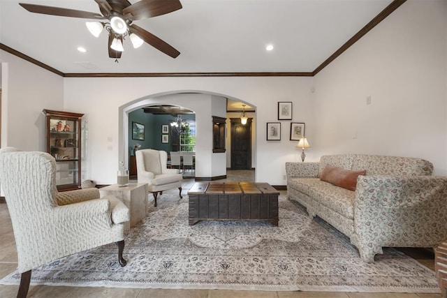 1401 Canyon Bridge Ln, Edmond, OK 73034 - living area with arched walkways, a ceiling fan, crown molding, a chandelier, and recessed lighting
