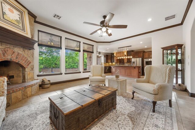 1401 Canyon Bridge Ln, Edmond, OK 73034 - living room featuring healthy amount of natural light, light tile patterned floors, ornamental molding, a ceiling fan, and recessed lighting