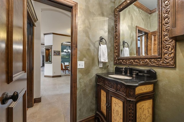 1401 Canyon Bridge Ln, Edmond, OK 73034 - bathroom featuring crown molding, tile patterned floors, vanity, and baseboards