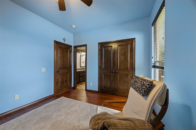 1401 Canyon Bridge Ln, Edmond, OK 73034 - living area with wood finished floors, ceiling fan, and baseboards
