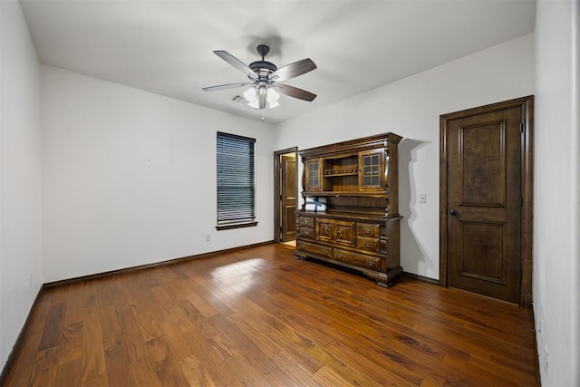 1401 Canyon Bridge Ln, Edmond, OK 73034 - bedroom featuring baseboards, dark wood-style floors, and a ceiling fan