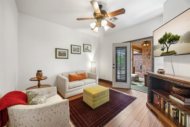 1401 Canyon Bridge Ln, Edmond, OK 73034 - living area featuring ceiling fan, wood finished floors, and baseboards