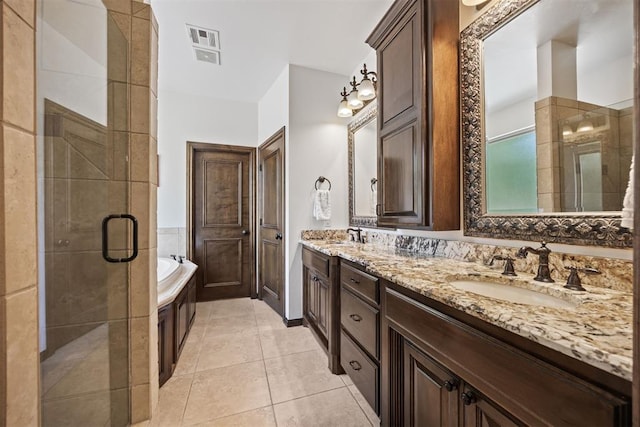 1401 Canyon Bridge Ln, Edmond, OK 73034 - full bathroom with a shower stall, a bath, double vanity, and tile patterned floors