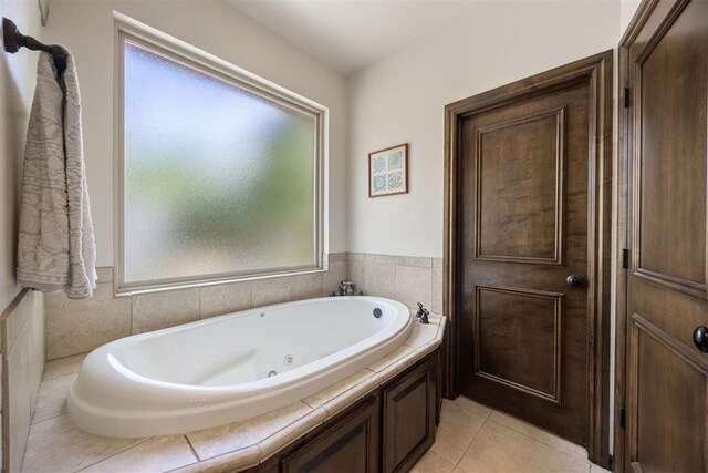 1401 Canyon Bridge Ln, Edmond, OK 73034 - bathroom with a tub with jets and tile patterned floors