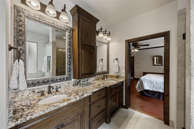 1401 Canyon Bridge Ln, Edmond, OK 73034 - full bathroom with a ceiling fan, tile patterned flooring, double vanity, and connected bathroom