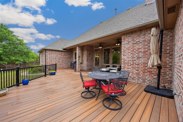 1401 Canyon Bridge Ln, Edmond, OK 73034 - wooden deck featuring fence, outdoor dining space, and ceiling fan