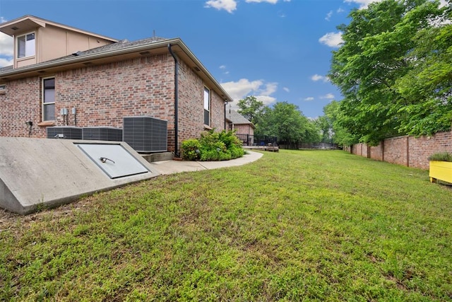 1401 Canyon Bridge Ln, Edmond, OK 73034 - entry to storm shelter featuring central AC
