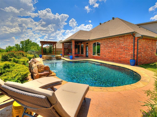 view of pool with a patio area and a pool with connected hot tub