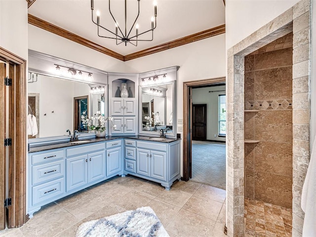 full bathroom featuring a chandelier, ornamental molding, double vanity, and a walk in shower