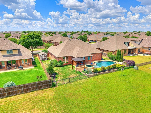 aerial view of residential area featuring a pool