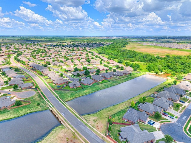 aerial perspective of suburban area featuring a nearby body of water