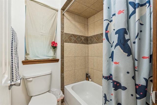 bathroom featuring shower / bath combo and toilet