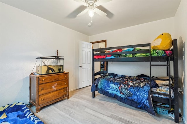 bedroom featuring wood finished floors and ceiling fan