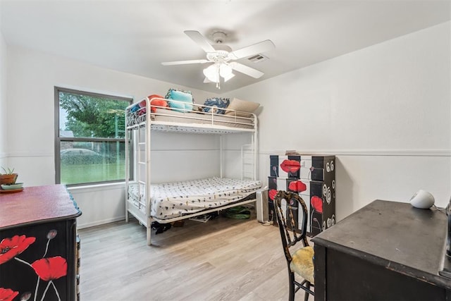 bedroom featuring light wood-type flooring and ceiling fan