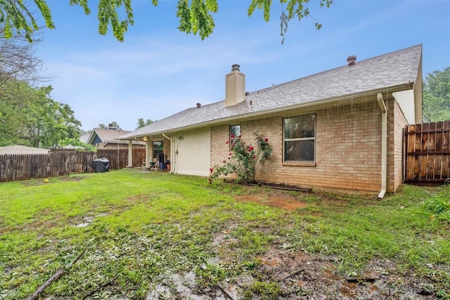 back of property featuring a chimney