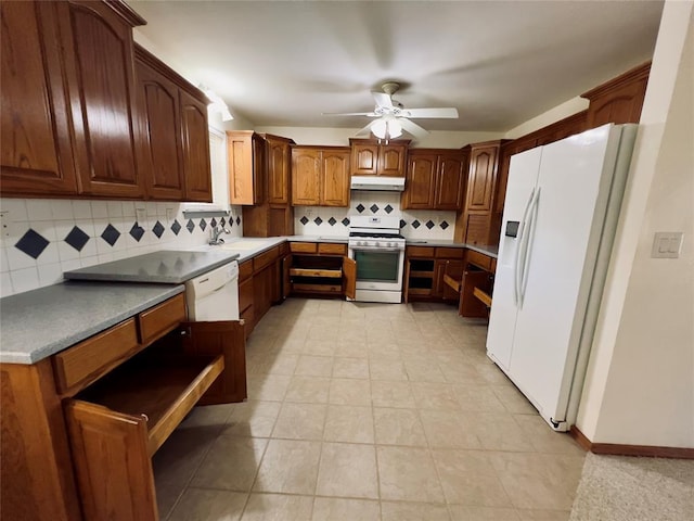 36040 E 1140th Rd Unit 114Rd, Seminole, OK 74868 - kitchen with white appliances, under cabinet range hood, ceiling fan, decorative backsplash, and a sink