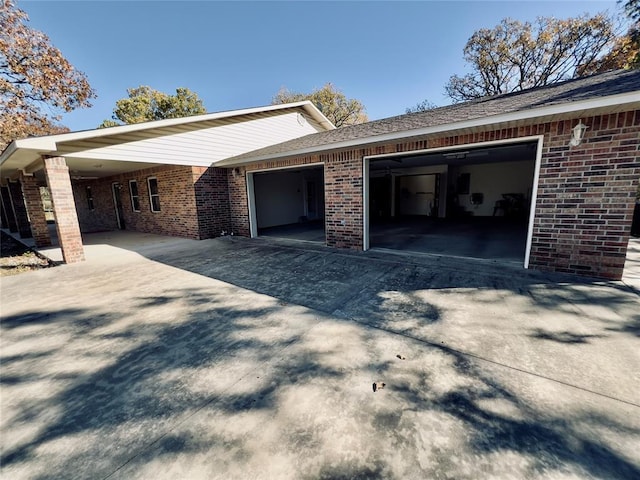 36040 E 1140th Rd Unit 114Rd, Seminole, OK 74868 - view of home's exterior featuring concrete driveway, an attached garage, and brick siding