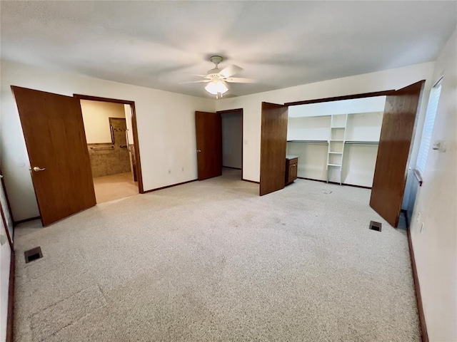 36040 E 1140th Rd Unit 114Rd, Seminole, OK 74868 - unfurnished bedroom featuring light carpet, a ceiling fan, baseboards, and connected bathroom