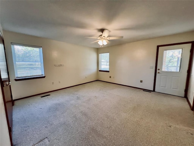36040 E 1140th Rd Unit 114Rd, Seminole, OK 74868 - unfurnished room with baseboards, light carpet, and a ceiling fan