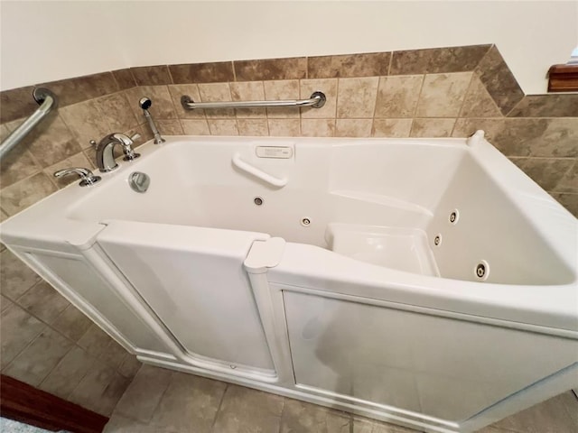 36040 E 1140th Rd Unit 114Rd, Seminole, OK 74868 - bathroom featuring a tub with jets and tile patterned floors