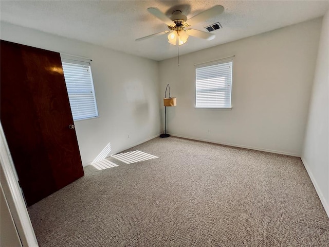 36040 E 1140th Rd Unit 114Rd, Seminole, OK 74868 - unfurnished room with carpet flooring, ceiling fan, and baseboards