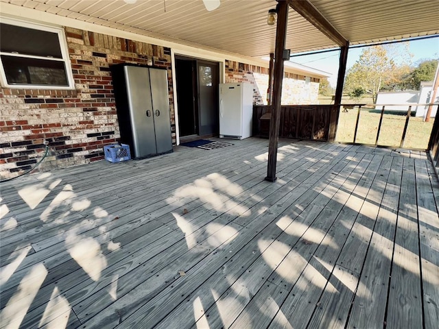 36040 E 1140th Rd Unit 114Rd, Seminole, OK 74868 - deck featuring a ceiling fan