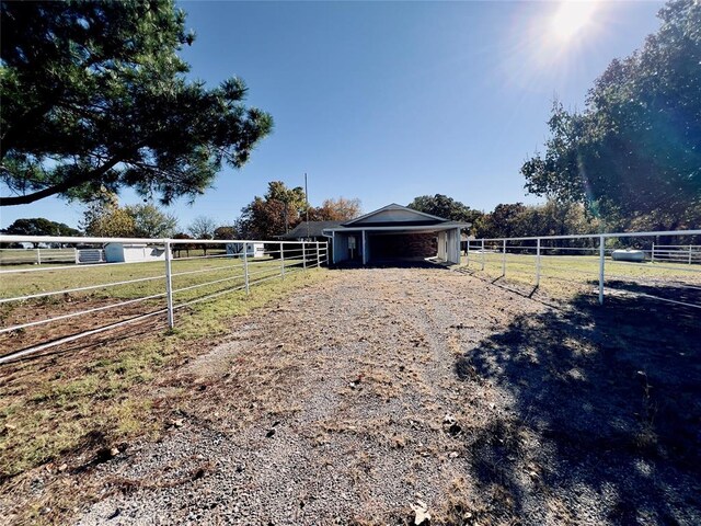36040 E 1140th Rd Unit 114Rd, Seminole, OK 74868 - view of yard featuring an exterior structure and a view of rural / pastoral area