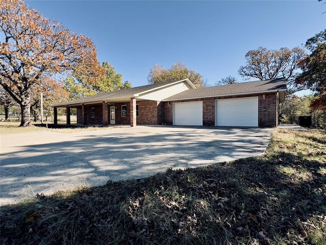 36040 E 1140th Rd Unit 114Rd, Seminole, OK 74868 - single story home with concrete driveway, a garage, and brick siding
