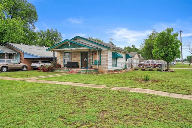 view of front of property with a front lawn and a porch