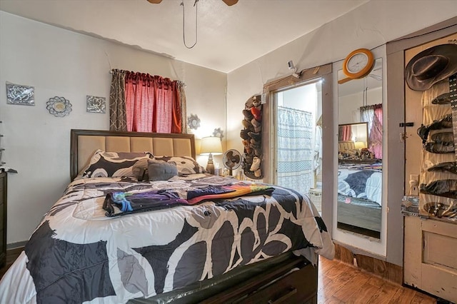 bedroom featuring wood finished floors and a ceiling fan