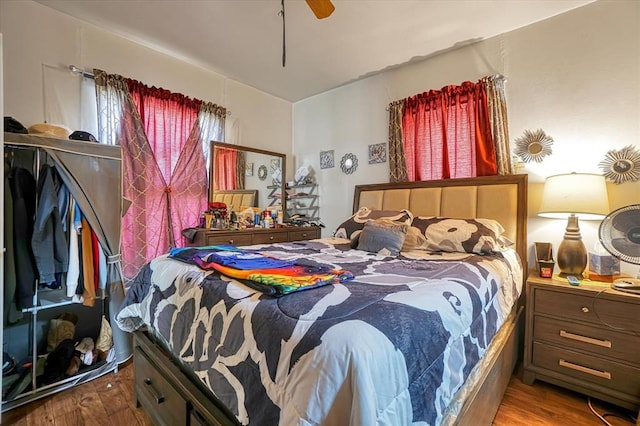 bedroom with wood finished floors and a ceiling fan