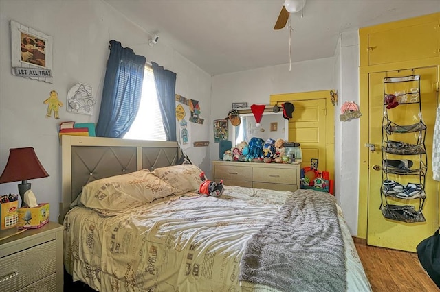 bedroom with wood finished floors and ceiling fan
