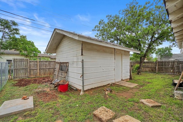 view of outdoor structure with a fenced backyard