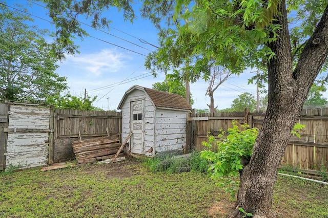 view of shed with a fenced backyard