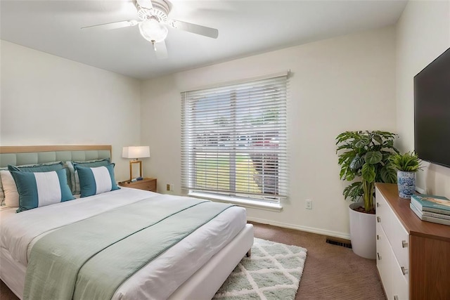 2617 Tracys Ter, Edmond, OK 73013 - bedroom with carpet flooring, baseboards, and ceiling fan