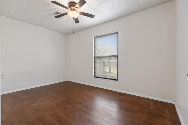 5102 N Beaver Ave, Bethany, OK 73008 - spare room featuring wood finished floors, ceiling fan, a textured ceiling, and baseboards