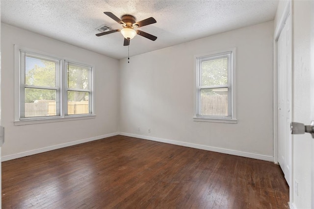 5102 N Beaver Ave, Bethany, OK 73008 - spare room featuring wood-type flooring, ceiling fan, baseboards, and a textured ceiling