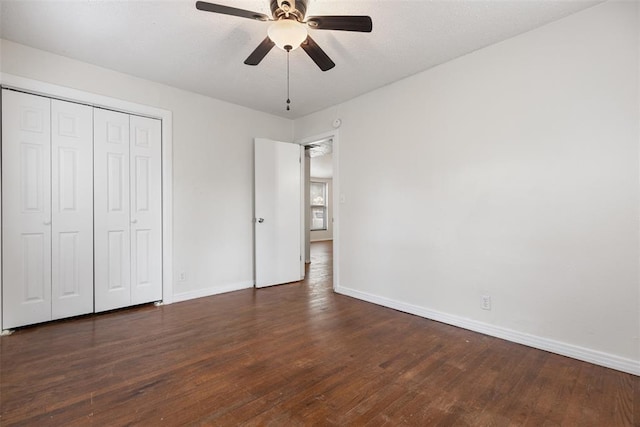 5102 N Beaver Ave, Bethany, OK 73008 - unfurnished bedroom featuring wood finished floors, baseboards, a closet, and a ceiling fan