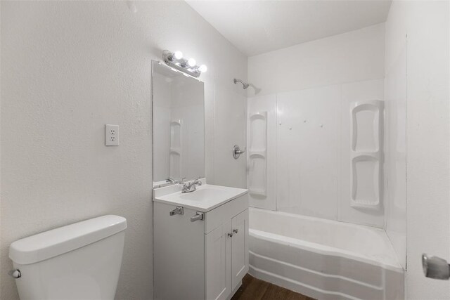 5102 N Beaver Ave, Bethany, OK 73008 - bathroom featuring toilet, shower / bathtub combination, vanity, and wood finished floors