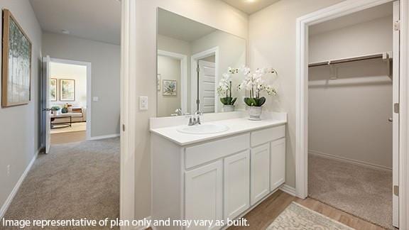 10509 SW 23rd St, Yukon, OK 73099 - bathroom with vanity and baseboards