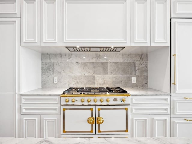 6100 NW Grand Blvd Unit 6103, Oklahoma City, OK 73118 - kitchen with double oven range, white cabinetry, decorative backsplash, and light stone countertops